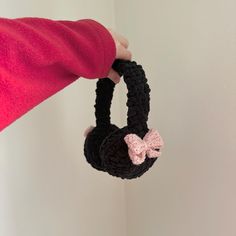 Cozy earmuffs that are perfect for the cold weather, adding a pop of colour to your outfit or covering up when you feel overstimulated. Each earmuff is hand crafted and crocheted, which contributes to the uniqueness of every piece :) SIZING Earmuffs are one size, however crochet stitches do have some flexibility. If you wiggle the headband piece up and down you can add an additional couple centimeters to adjust earpiece coverage HEADBAND DIMENSIONS Width - 6.5" (widest point) Length - 5.5" (high Ear Muffs Outfit, Crochet Ear Muffs, Black Ear Muffs, Crochet Earmuffs, Ear Muffs, Pink Bows, Polyester Yarn, Earmuffs, Ear Warmers