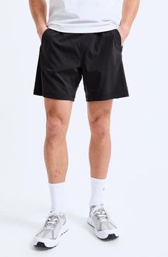 Be workout-ready and on trend in these lightweight training shorts cut with a shorter inseam. They're made from moisture-wicking fabric with laser-cut mesh side panels for extra breathability. 7" inseam; 25" leg opening; 11 1/2" front rise Elastic/drawstring waist Front slant pockets; hidden sweat-resistant side-zip pocket Moisture-wicking fabric engineered for dryness and comfort Four-way-stretch fabric 85% nylon, 15% spandex Machine wash, tumble dry Imported Reigning Champ, Training Shorts, Fabric Gift Bags, Nordstrom Store, Fabric Gifts, Free Fabric, Side Panels, Black Fits, Moisture Wicking Fabric