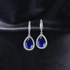 12ct Huge Pear Created Blue Sapphire 925 Sterling Silver Dangle Earrings Elevate your style with these stunning dangle earrings featuring a luxurious lab-created blue sapphire. Crafted from solid 925 sterling silver, these earrings are designed for both beauty and durability. High-Quality Materials The earrings are made of: Material: Solid S925 sterling silver Gemstone: Lab created blue sapphire Tarnish-Resistant: Rhodium plating ensures long-lasting shine Hypoallergenic: Nickel-free, lead-free, Sapphire Dangle Crystal Earrings For Formal Occasions, Sapphire Crystal Dangle Earrings For Formal Occasions, Sapphire Crystal Dangle Earrings For Formal Events, Sapphire Crystal Drop Earrings For Formal Occasions, Elegant Blue Crystal Earrings, Blue Sapphire Pear-shaped Earrings, Elegant Sapphire Crystal Dangle Earrings, Elegant Sapphire Crystal Drop Earrings, Sapphire Drop Crystal Earrings