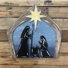 a nativity scene with three wise men and a star