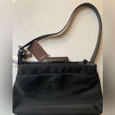 Nwt Coach Mercer Zip Jet Black Shoulder Bag Fabric/Leather. Style 7412. Adjustable Leather Strap, Flap Snap Closure, One Large Outside Snap Pocket. 2 Large Inside Compartments, One Large And One Small Zipper Compartment. Shoulder Drop To 11”, Height 9”, Width 13”, Depth 3.5”. Coach Shoulder Bag For Office, Elegant Coach Shoulder Bag For Travel, Formal Coach Shoulder Bag With Leather Handles, Grey Shoulder Bag, Gray Handbags, Bag Fabric, Coach Shoulder Bag, Coach Crossbody Bag, Black Leather Handbags