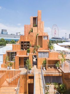 an apartment building made out of wooden blocks