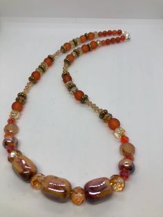 Necklace is made with red, brown and orange glass and ceramic beads Perfect necklace for autumn wear, or makes a good gift for the women in your life. Mecklace is 20 inches long Orange Beaded Necklace, Autumn Wear, Autumn Necklace, Brown And Orange, Necklace Chunky, Chunky Necklace, Ceramic Beads, Red Brown, 20 Cm