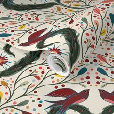 a white wallpaper with red, green and blue birds on it's surface