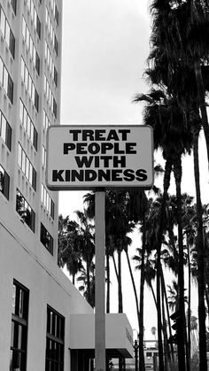 there is a sign that says treat people with kindness