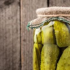 pickles in a mason jar with burlied string