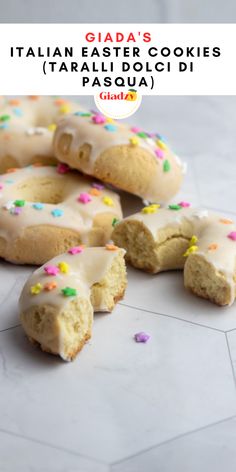 there are several cookies with icing and sprinkles on them