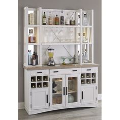 a white cabinet with lots of bottles and glasses on top of it's shelves