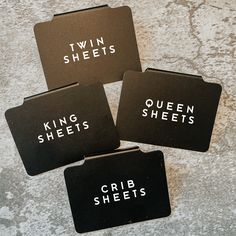 four black coasters with the words king sheets, queen sheets, and crib sheets