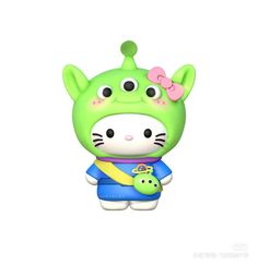 a green toy with a pink bow on it's head