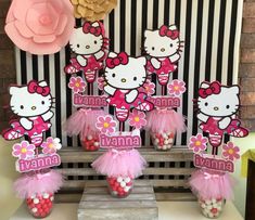 hello kitty themed birthday party with pink tulle skirts and candy in the shape of flowers