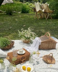 a picnic table with plates and baskets on it