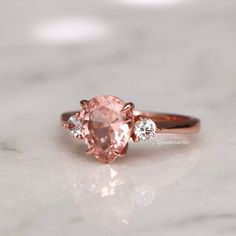 Beautiful Vintage Inspired Morganite Ring ►Base metal: Sterling silver (925) ►Plating: 14K Rose Gold ►Accented With Simulated Diamonds (CZ) Main Stone: Morganite Stone Creation: Lab-Created Color: Peachy-Pink Stone Cut: Teardrop Gem size: 7.0 x 9.0 mm Carat Weight: 1.6 ct. (approx.) ►Please be aware that plated jewelry can wear off over time, if this is a concern we would suggest going with the sterling silver or solid gold jewelry option. ✓ Comfort Fit ✓ Free Ring Box ✓ Free USA Shipping Pink Morganite Engagement Ring, Rose Gold Accents, Morganite Engagement, Pink Morganite, Morganite Engagement Ring, Morganite Ring, Vermeil Jewelry, Silver Engagement Rings, Solid Gold Jewelry