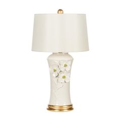 a white and gold lamp with flowers on it