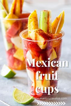 mexican fruit cups with strawberries, celery, and limes in them