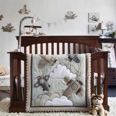 a baby crib with a teddy bear next to it