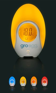 an alarm clock with four different colors on the front and back sides, all displaying the time