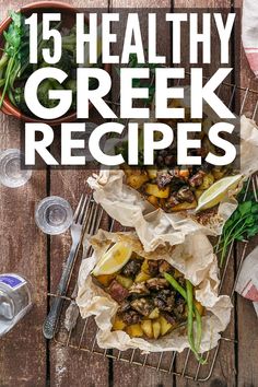 the cover of 15 healthy greek recipes on a wooden table with wine glasses and utensils