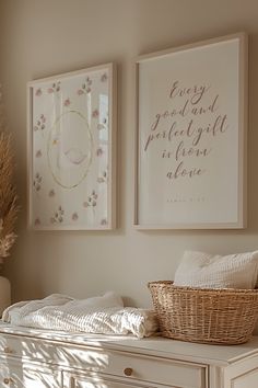 two framed pictures hang on the wall above a white dresser with baskets and pillows in front of it