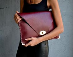 Bordeaux Symmetria Clutch.The perfect bag for all occasions!Ideal for cocktail and parties or for business meetings depending the size you choose.You can use it as a chic briefcase for your work or as a modern large clutch for a night out.This adorable clutch is handmade out of a genuine, lux Italian bordeaux cow leather.-Small size fits all your essentials, wallet, keys, mobile, cosmetics etc. -Large size fits a 15" laptop, ipad, portofolio etc and it's perfect as a file folder or as modern a l Chic Envelope Clutch For Business, Chic Business Envelope Clutch, Modern Envelope Clutch For Office, Leather Envelope Clutch For Office, Elegant Envelope Bag With Laptop Sleeve, Foot Socks, Large Clutch, Leather Clutch Bag, Envelope Clutch