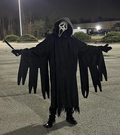 a person in a costume standing on the street