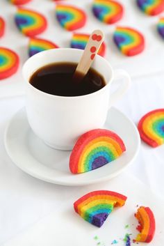 a cup of coffee and some rainbow cookies