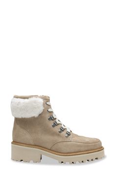 Fluffy genuine shearling lends a cozy touch to this lugged boot inspired by hiking styles. 2" heel 5" shaft (size 7) Lace-up style; side zip closure Cushioned footbed Leather and genuine-shearling (Brazil) upper/leather lining/rubber sole Made in Brazil Shearling Boots With Lug Sole And Round Toe, Winter Suede Moto Boots With Lug Sole, Winter Boots With Suede Lining And Shearling Material, Sheepskin Ankle Boots With Suede Lining, Winter Shearling Boots With Lug Sole, Shearling Ankle Boots With Faux Fur Lining, Sheepskin Boots With Faux Fur Trim And Round Toe, Shearling Boots With Faux Fur Lining And Round Toe, Leather Ankle Boots With Faux Fur Trim