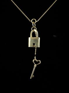 Vintage Designer Gold Over Sterling Lock & Heart Key Necklace 32" Item here is a vintage designer gold over sterling silver lock and heart key necklace. This necklace is marked sterling silver on the tip of the key. This lock and key are functional and the key will open the lock. Necklace closes with a spring ring. Super interesting design with the chain broken into sections and working lock and key.  Top quality! Designer Made in Italy. This designer created designs in horses, snakes, goth and other equestrian jewelry. Very well made.   Sample/New Old Stock!  Condition: Great; item is pre-owned and may have some signs of light use and age related wear. Please look closely at the pictures provided as they are an extension of our written description. Measurements: Length: 32 in Chain Width: Equestrian Jewelry, Key Jewelry, Lock Necklace, Heart Key, Interesting Design, Heart And Key, Key Necklace, Beauty Queen, Lock And Key