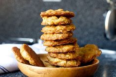 a wooden bowl filled with cookies on top of a table