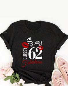 a black shirt that says classy 30 fabulous with red lipstick on it and some flowers