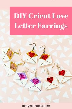 the diy cricut love letter earrings are made from paper and have hearts on them