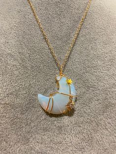 Opalite Crescent Moon with a gold wire wrap with two dangling charms; one a sparkly sun and a gold star.  Very celestial!! Sun And Stars, Charm Pendant Necklace, Gold Star, Gold Wire, Star Charms, Gold Stars, Wire Wrap, Croissant, Crescent Moon