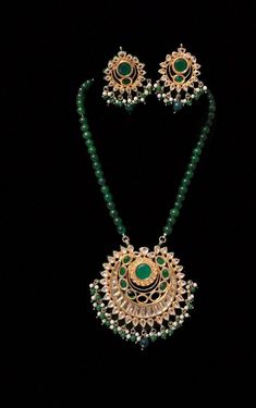 Semi Precious Emerald Kundan Long Necklace Set, Green Beads Necklace Set, Designer Indian Bridal Jewelry Set, Indian Emerald Jewelry Set, ITEM DESCRIPTION Metal        = Mixed Alloy Occasion  = Wedding, Party Wear, Bridal Color        = Green and Clear Free Shipping 100% Satisfaction Guarantee: 1 Year Warranty, Long Lasting Plating, High-Quality Stones Occasion: Perfect choice for any Indian occasion.  Care: It is advisable that you keep products away from direct heat, humidity, and moisture. It is best to preserve your jewelry in the box. Keep Away From Water, Spray And Perfumes For Better Look. Happy Buying :) Luxury Emerald Meenakari Necklace For Festivals, Luxury Green Temple Necklace With Meenakari, Emerald Beads Jewelry Indian Pendant, Luxury Emerald Necklace With Meenakari For Festivals, Luxury Emerald Chandbali Necklace With 17 Jewels, Luxury Traditional Emerald Necklace For Diwali, Luxury Meenakari Emerald Necklace For Festivals, Luxury Gift Emerald Chandbali Necklace, Luxury Green Temple Necklace With Tilla