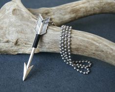 "Arrow necklace comprised of an antiqued silver tone arrow pendant measuring 2 1/2\" that is wrapped with black wire and hung from a stainless steel cable chain or stainless steel ball chain. Choose chain style and length at checkout: 22\". 24\". 26\". 28\". original WearYourWild design More arrow jewelry can be found here: http://etsy.me/1MO3M4g To see more of my handmade jewelry in my Etsy shop, click this link: WearYourWild.etsy.com All jewelry comes nestled in recycled, rustic kraft gift box Arrow Pendant Necklace, Sagittarius Necklace, Arrow Jewelry, Antler Necklace, Arrow Pendant, Metal Style, Ball Chain, Cable Chain, Silver Heart