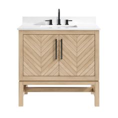 a bathroom vanity with a white sink and wood cabinetry on the top, along with two black faucets