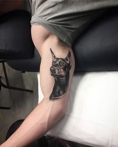 a man with a dog tattoo on his arm