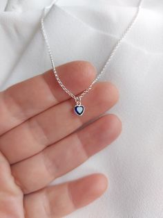 "Pendant measures 5 mm. Sterling Silver Dainty sapphire Heart Necklace Pendant. Please choose your favorite necklace length at checkout. All lengths have a one inch extender, that way you'll have some wiggle room to play with the length. For example, if you choose a 14 inches necklace length, you'll have options to close the necklace at any length between 14 inches and 15 inches.  Some of this charms are sold by themselves (no chain). If that option is available for this, you will have the option to buy \"CHARM ONLY\" before adding the item to the cart. Normally, a 3 mm ring made out of the same material is attached to the charm. If you own a chain and plan to use the charm for it, ensure that the 3 mm ring will pass through, or you have a bigger ring if needed, and/or you know how to open Sterling Silver Heart Charm Birthstone Necklace, Sapphire Heart Pendant Necklace In Sterling Silver, Sapphire Sterling Silver Heart Pendant Necklace, Sterling Silver Heart Cut Sapphire Necklaces, Sterling Silver Sapphire Heart Cut Necklaces, Heart Shaped Sapphire Jewelry For Gifts, Heart Shaped Sapphire Jewelry Gift, Heart-shaped Sapphire Jewelry Gift, Heart Cut Sapphire Sterling Silver Necklaces