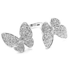 Van Cleef & Arpels 18k White Gold Diamond Two Butterfly Between Finger Ring  Metal: 18k White Gold  Size: European 52, US 6  Weight: 9.2 grams  Width; 20mm  Stones: 70 round brilliant cut diamond VVS1 clarity, E color total weight 1.67ct  Hallmarks: Cartier 750 52 JA19XXX (Serial Omitted) T3352ooled  Dimensions reference the ring size and are not specific to the ring itself. Between Finger Ring, Ring Metal, Van Cleef Arpels, Van Cleef, Finger Ring, Ring Finger, Round Brilliant Cut Diamond, Brilliant Cut Diamond, Metal Rings