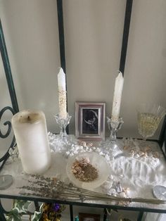 a table topped with candles and other items