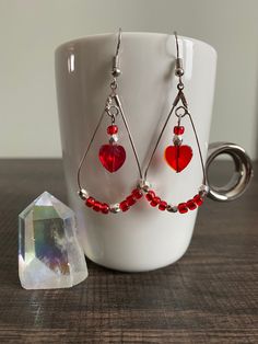 Adorable handmade teardrop earrings made with red glass 6/0 seed beads and silver faceted spacer beads. Featuring glass red heart beads dangling at the center. Perfect for Valentines Day and very lightweight!  * All materials were cleaned and sanitized prior to use and kept in a clean smoke free environment. Comes packaged in a mesh drawstring bag. Diy Beaded Valentine Earrings, Valentine Earrings Beaded, Valentine Jewelry Diy, Diy Valentine Jewelry Ideas, Valentines Jewelry Ideas, Valentines Day Jewelry Diy, Valentines Beaded Jewelry, Valentine Earrings Diy, Valentine’s Day Jewelry