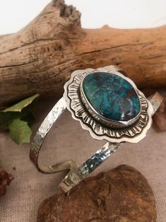 This Stunning large piece of Turquoise is the most unique combination of a deep rich blue and dark red. A true statement bracelet with intricately textured cuff. Sterling Silver Red Skin Turquoise Cuff is 6” long with a 1” gap Turquoise Artisan Cuff Bracelet With Natural Stones, Artisan Turquoise Cuff Bracelet With Natural Stones, Red A, Warm Red, Turquoise Cuff, Special Jewelry, Statement Bracelet, Pin Cushions, Unique Earrings