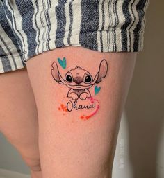 a woman's leg with an elephant tattoo on her thigh and the word mama written across it