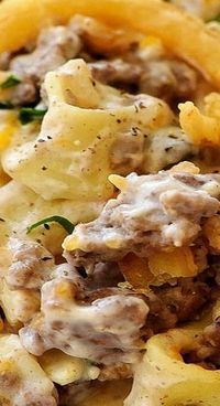 a close up of food on a plate with pasta and meat in the middle,