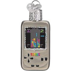 an electronic device is decorated with beads and a keychain that says tetris