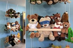 stuffed animals are hanging from the ceiling and on shelves in a child's room