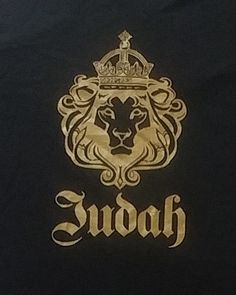 a black shirt with gold lettering and a lion's head on the front that says swooh