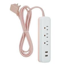 the pink power strip is plugged in to an extension cord with two usb cables