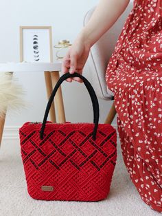 Add a pop of vibrant color to your wardrobe with this unique purse. This striking red shopper adorned with black beads is perfect for those who love to stand out. Crafted from durable polyester cord, the high-quality beads and leather backing ensure the bag maintains its shape and style for years to come. The silver lock adds a touch of elegance, while the fabric lining provides practicality. Whether you're treating yourself or looking for a great gift, this bold, colourful accessory is a must-h Red Crochet Tote Bag As Gift, Red Crochet Tote Bag For Gift, Handmade Red Shoulder Bag For Travel, Handmade Red Bags For Everyday, Handmade Red Shoulder Bag, Red Handmade Shoulder Bag For Daily Use, Handmade Red Crochet Bag For Daily Use, Red Crochet Tote Bag For Everyday, Handmade Red Square Bag