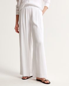 Elevate your wardrobe with the Abercrombie & Fitch Women's Crinkle Textured Pull-On Pants. These ultra high-rise, wide-leg pants are the epitome of comfort and style, crafted in a breezy, crinkle-textured fabric that flows with every step.

- Size: XXXL LONG
- Color: White
- Material: Body - Viscose, Nylon; Lining - Viscose
- Gender: Female
- Style: Pull-on with an elasticated waistband for easy wear and adjustability

Perfect for a relaxed day out or a chic office look, these pants promise vers Pants Design, Viscose Fabric, Textured Fabric, Pull On Pants, Easy Wear, Abercrombie Fitch, Leg Pants, Wide Leg Pants, Chic Style