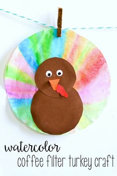 a paper plate with a turkey on it that says watercolor coffee filter turkey craft